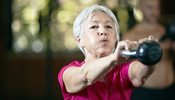 Woman Exercising with Kettlebell